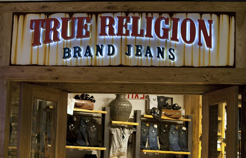 True Religion Apparel Inc. signage is displayed outside of a store at the Beverly Center mall in Los Angeles, California, U.S., on Monday, Dec. 5, 2011. Since the Federal Reserve's last meeting early in November, reports on employment, manufacturing and retail sales have dispelled concerns the world's largest economy may slide back into recession. Photographer: Konrad Fiedler/Bloomberg