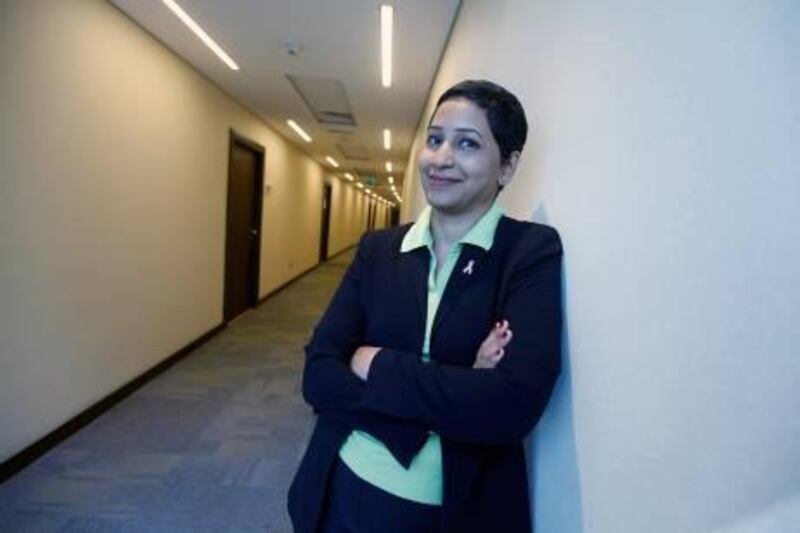 Dubai , United Arab Emirates- October 12, 2011:  Suchita Dsouza,  breast cancer survivor pose outside her office  in Dubai.  ( Satish Kumar / The National )  