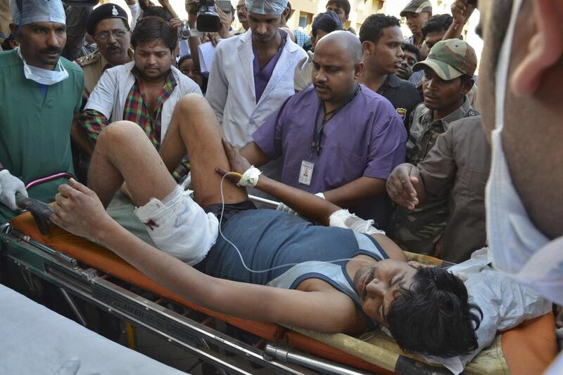 An injured Indian paramilitary soldier is taken to a hospital at Raipur in Chhattisgarh state after Maoist rebels ambushed police and killed 20. Reuters / March 11, 2014