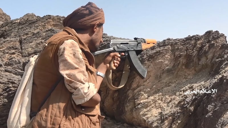 A Houthi fighter with an amputated right arm takes position, in a frame grab from video handed out by the Houthi media centre. Reuters