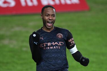 Manchester City's Raheem Sterling celebrates scoring their side's second goal of the game during the Emirates FA Cup fifth round match at Liberty Stadium, Swansea. PA
