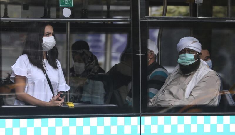 People wearing protective face masks against the spread of the novel corona virus, Covid-19,  as they travel on a public bus in Ankara.   AFP