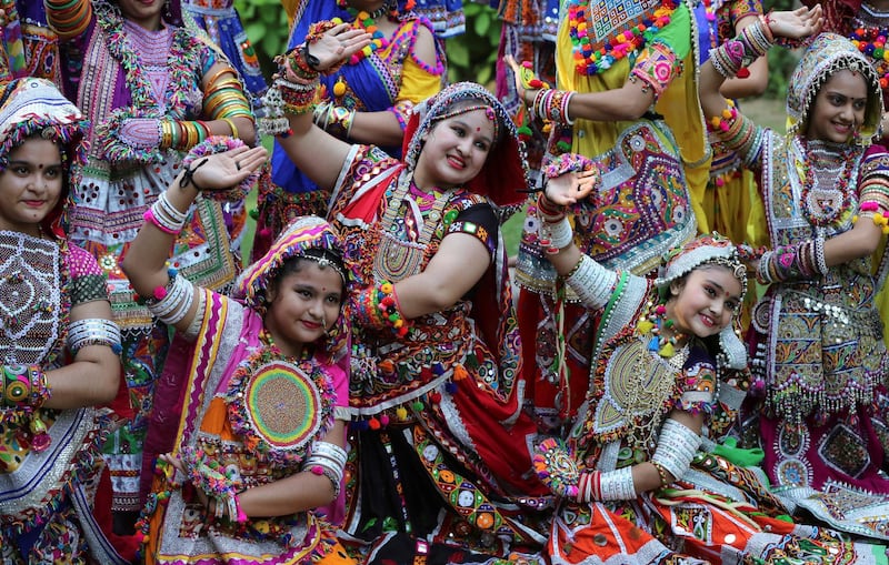 Participants pose during rehearsals for Garba, a folk dance, ahead of Navratri, a festival during which devotees worship the Hindu goddess Durga and youths dance in traditional costumes, in Ahmedabad, India. Reuters