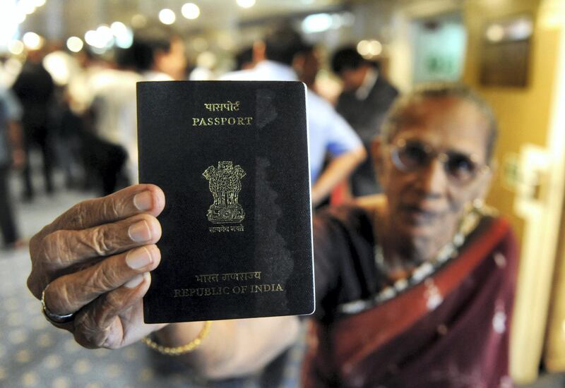 An Indian passenger holds up her passport on the Scotia Prince passenger ferry after its arrival from the Indian port of Tuticorin, in Colombo on June 14, 2011.   A passenger ferry began operations between India and Sri Lanka for the first time in 28 years after a previous service was disrupted by the island's ethnic war, officials said.  Some 201 passengers aboard the Scotia Prince arrived in Colombo on June 14, 2011 from Tuticorin on the inaugural journey of about 14 hours across the Palk Straits.   AFP PHOTO/Ishara S. KODIKARA / AFP PHOTO / Ishara S.KODIKARA