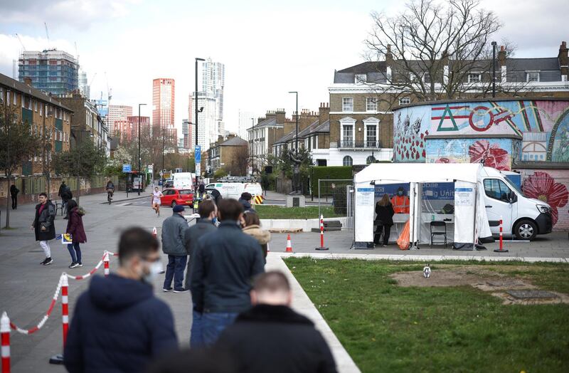 People queue at a mobile coronavirus disease (COVID-19) testing site in Stockwell, London, Britain, April 16, 2021. REUTERS/Henry Nicholls