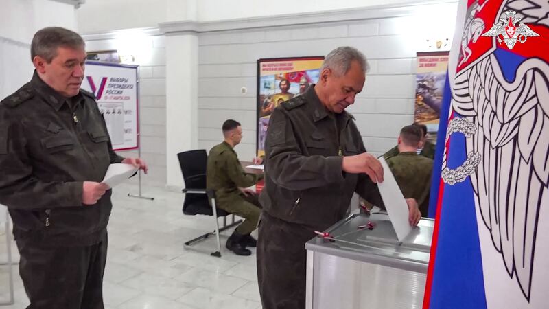Russia's Defence Minister Sergei Shoigu and army chief of staff Valery Gerasimov vote. AFP