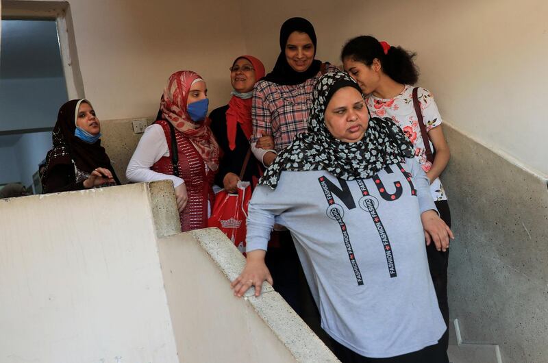 Members of Al Nour Wal Amal (Light and Hope) chamber orchestra of blind women prepare for their first concert, following months in limbo due to the coronavirus pandemic. Reuters