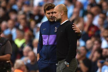 Tottenham Hotspur manager Mauricio Pochettino, left, and his Manchester City counterpart Pep Guardiola settled for a 2-2 draw on Saturday. Oli Scarff / AFP