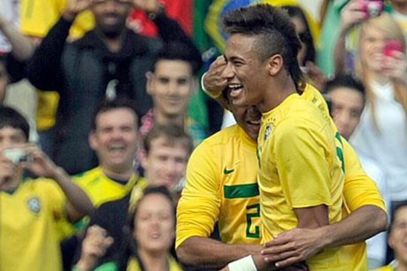 Brazil's Neymar celebrates after scoring the second goal against Scotland at the Emirates Stadium in London. Tom Hevezi / AP Photo