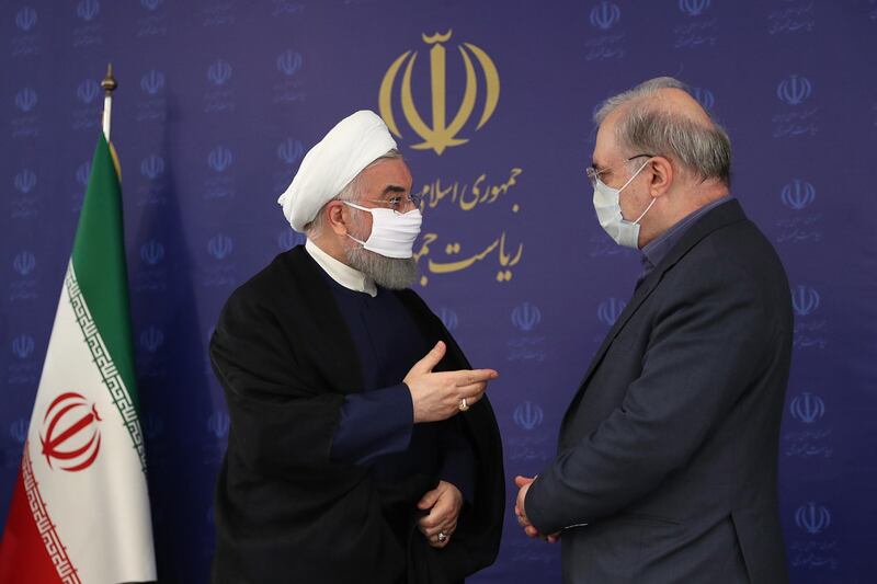 epa08526353 A handout photo made available by the presidential office shows Iranian President Hassan Rouhani (L) wearing face mask while talking to Iranian Health Minister Saeed Namaki (R) during the cabinet meeting in Tehran, Iran, 04 July 2020. Media reported that Rouhani again urged the people to wear face masks and announced wearing face masks in government offices, public crowded places is obligated as the spread of novel coronavirus (Covid-19) has grown up in past month in Iran.  EPA/PRESIDENT OFFICE HANDOUT  HANDOUT EDITORIAL USE ONLY/NO SALES