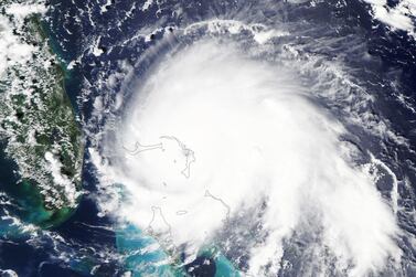 epa07811932 A handout photo made available by NASA shows a natural-color satellite image of Hurricane Dorian at 2:05 p.m. Eastern Daylight Time (18:05 Universal Time), 01 September 2019 (issued 02 September 2019). In picture at far-left is seen Florida, USA. Powerful category 5 storm Dorian, with sustained winds of about 295kph, appears in this image directly over Great Abaco, an island in the northern Bahamas. The US National Hurricane Center reported that Dorian had become the strongest hurricane on record in the northwestern Bahamas. EPA/NASA EARTH OBSERVATORY HANDOUT HANDOUT EDITORIAL USE ONLY/NO SALES