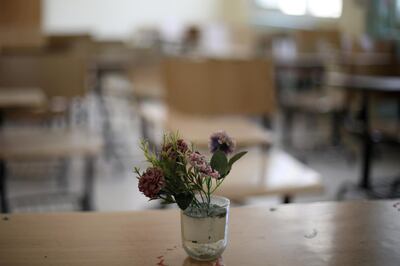 Flowers sit in water in a deserted class that is located at one of the public schools during the first day of public school teachers' open strike in Amman, Jordan, September 8, 2019. Picture taken September 8, 2019. REUTERS/Muhammad Hamed