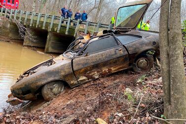 In this December 2021 photo provided by the Chambers County Sheriff's Department, the 1974 Pinto Kyle Clinkscales was driving when he disappeared in 1976, is recovered from a creek in Alabama.  Sheriff's officials have previously said Clinkscales was killed, but now are raising the possibility that he went off the road and crashed.  (Maj.  Terry "Tj" Wood / Chambers County Sheriff's Department via AP)