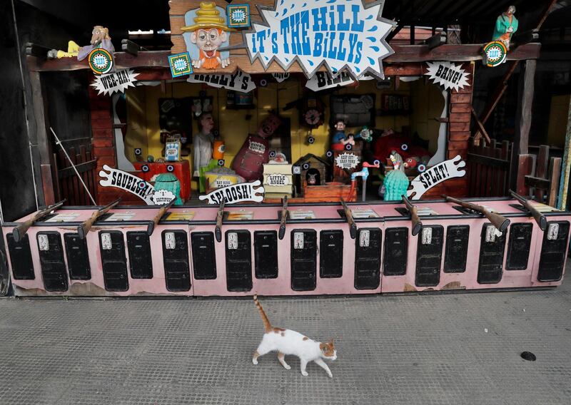 A cat passes at a deserted amusement park, during a lockdown that imposed by the government to help stem the spread of the coronavirus, in Beirut, Lebanon. AP Photo