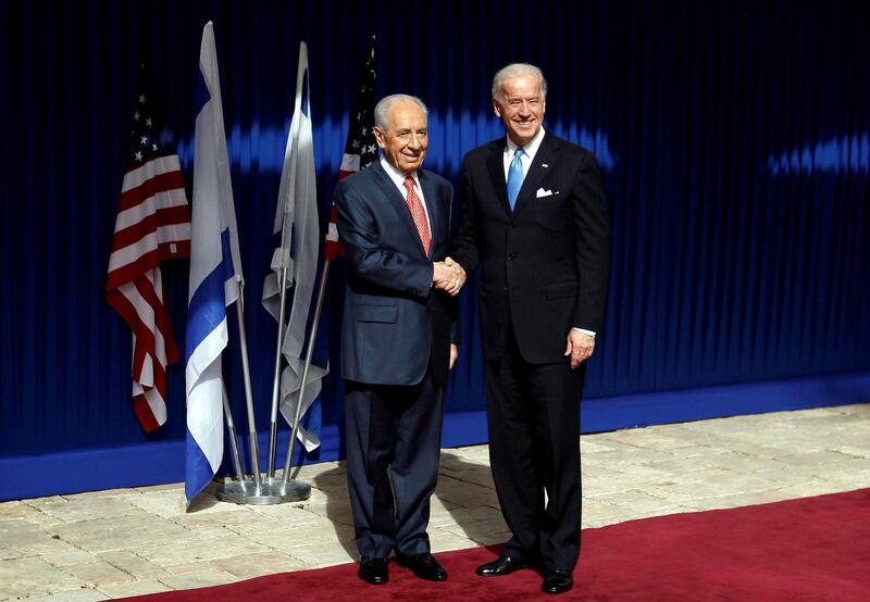 Israel's President Shimon Peres shakes hands with U.S. Vice President Joe Biden before their meeting at the president's residence in Jerusalem March 9, 2010. Reuters