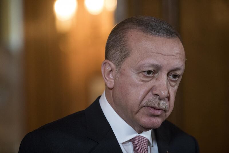 epa06740261 Turkey's president Recep Tayyip Erdogan speaks during a joint news conference with Britain's prime minister Theresa May (not pictured) inside number 10 Downing Street in London, Britain, 15 May 2018. Turkish President Recep Tayyip Erdogan said he intends to tighten his grip on the economy and take more responsibility for monetary policy if he wins an election next month.  EPA/Simon Dawson / POOL