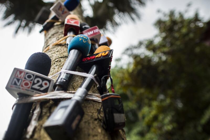 Microphones are seen taped to a tree before a press conference at the command centre as rescue operations continue for the 12 boys and their football team coach trapped in Tham Luang cave at Khun Nam Nang Non Forest Park in the Mae Sai district of Chiang Rai province. Ye Aung Thu/AFP
