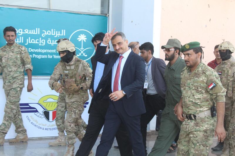 Aden's governor Hamed al-Amlas flashes the V-sign for victory upon his arrival at the southern Yemeni city's airport to welcome UN Special Envoy for Yemen Martin Griffiths. AFP