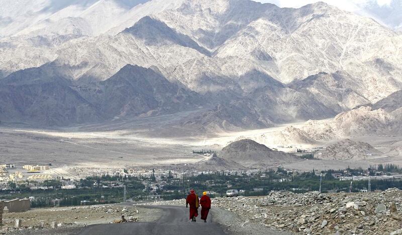 Buddhist monks walk on a road in Stok, 20 km north of Leh. Fayaz Kabli / Reuters    