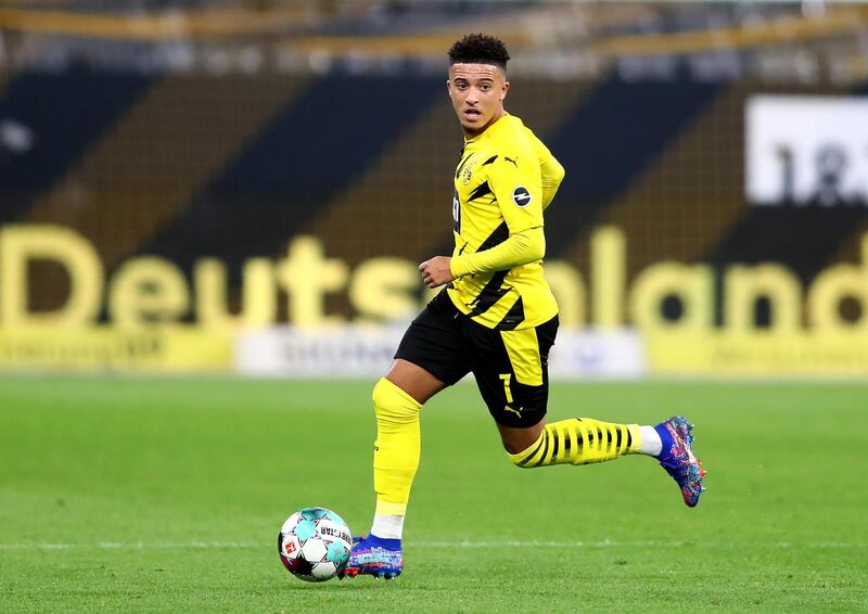 DORTMUND, GERMANY - OCTOBER 24: Jadon Sancho of Dortmund runs with the ball during the Bundesliga match between Borussia Dortmund and FC Schalke 04 at Signal Iduna Park on October 24, 2020 in Dortmund, Germany. A limited number of spectators (300) will be in attendance as Covid-19 pandemic restrictions are eased in Dortmund.  (Photo by Martin Rose/Getty Images)