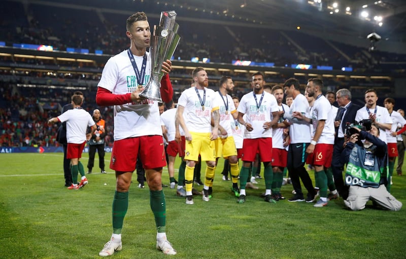 Cristiano Ronaldo celebrates with the Nations League trophy. Reuters