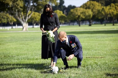 Prince Harry and Meghan Markle lay flowers picked from the garden of their Santa Barbara home on the graves of Australian and Canadian soldiers at Los Angeles National Cemetery, in honour of Remembrance Sunday LEE MORGAN/Handout via REUTERS