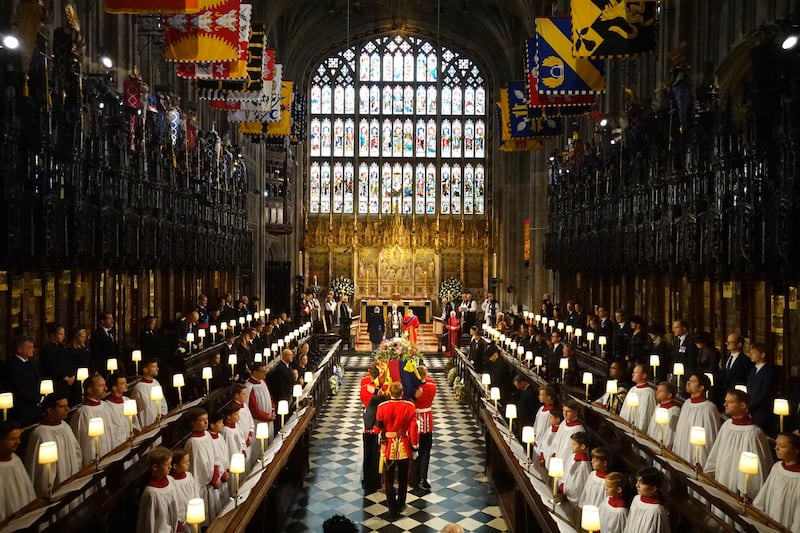 The coffin of Queen Elizabeth is carried into St George's Chapel in Windsor Castle for the committal service. PA