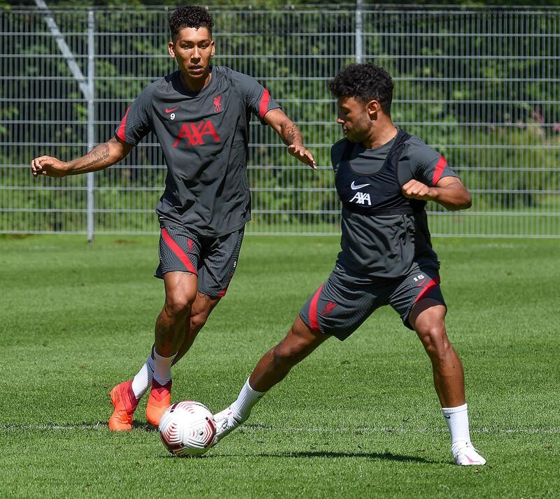 SALZBURG, AUSTRIA - AUGUST 16: (THE SUN OUT. THE SUN ON SUNDAY OUT) Alex Oxlade-Chamberlain of Liverpool with Roberto Firmino of Liverpool during a training session on August 16, 2020 in Salzburg, Austria. (Photo by John Powell/Liverpool FC via Getty Images)