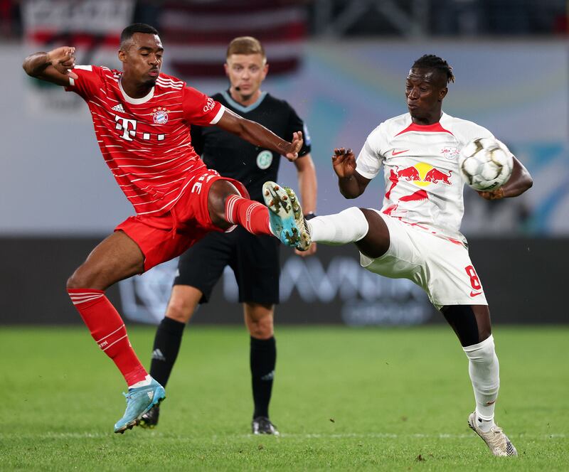 Ryan Gravenberch of Bayern Munich is challenged by Amadou Haidara of RB Leipzig. Getty Images