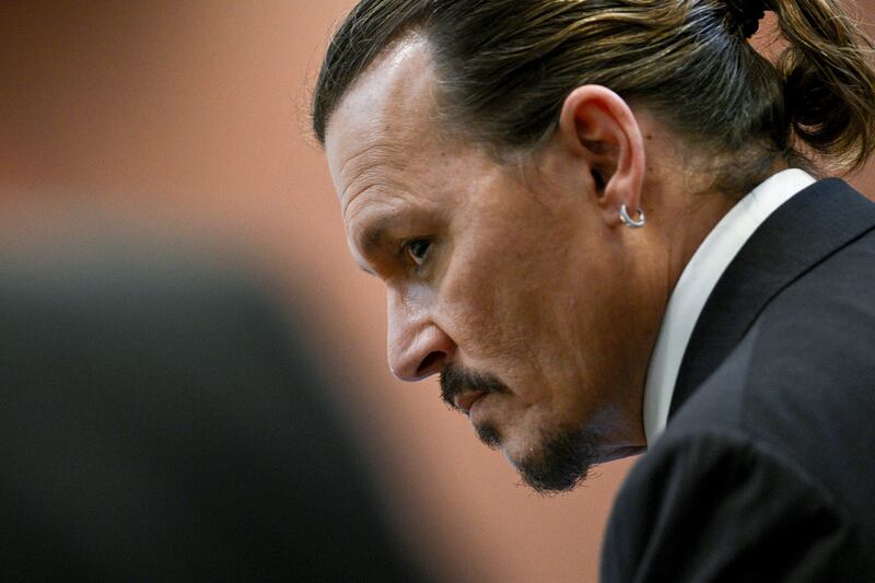 Depp insists he was never violent with his former wife and has never hit a woman. AP