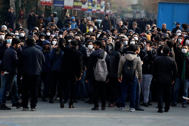 Anti-government protesters attend a demonstration blaming the government for the delayed announcement of the unintentional downing of a Ukrainian plane last week, at the Tehran University campus. AP Photo