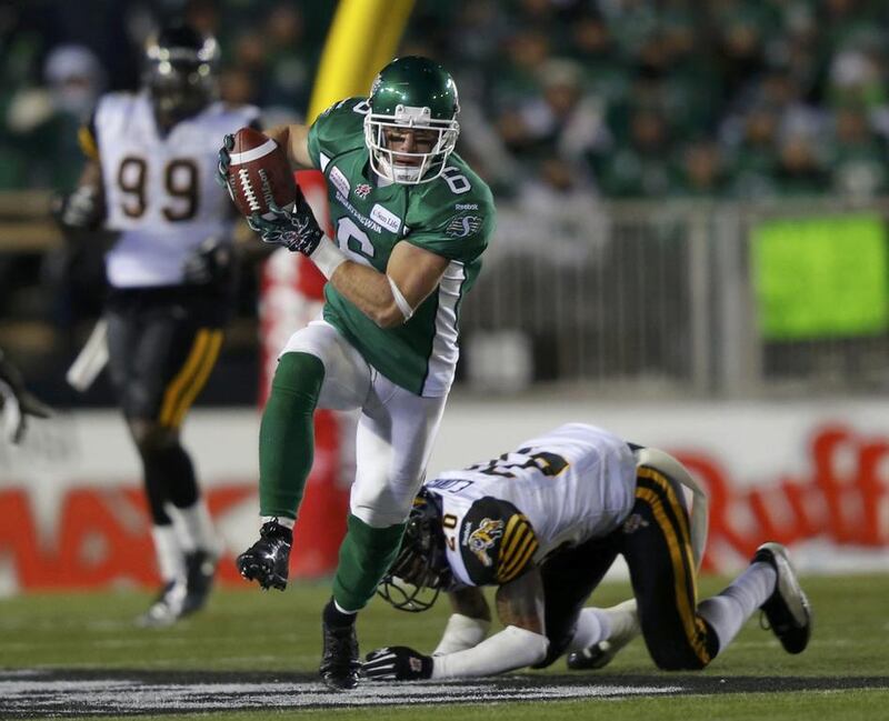 Saskatchewan Roughriders Rob Bagg heads up field after avoiding a tackle by Hamilton Tiger-Cats Emanuel Davis. Todd Korol / Reuters