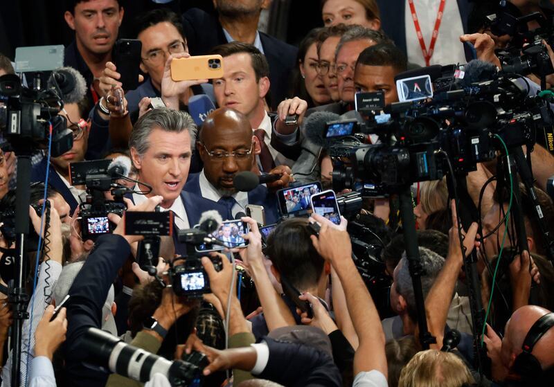 Governor Gavin Newsom and Senator Raphael Warnock speak to reporters after the debate. Getty Images