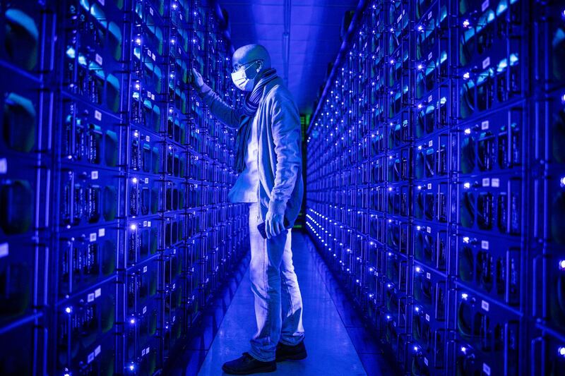 An employee wearing a protective face mask inspects mining rigs mining the Ethereum and Zilliqa cryptocurrencies at the Evobits crypto farm in Cluj-Napoca, Romania, on Wednesday, Jan. 22, 2020. The world’s second-most-valuable cryptocurrency, Ethereum, rallied 75% this year, outpacing its larger rival Bitcoin. Photographer: Akos Stiller/Bloomberg