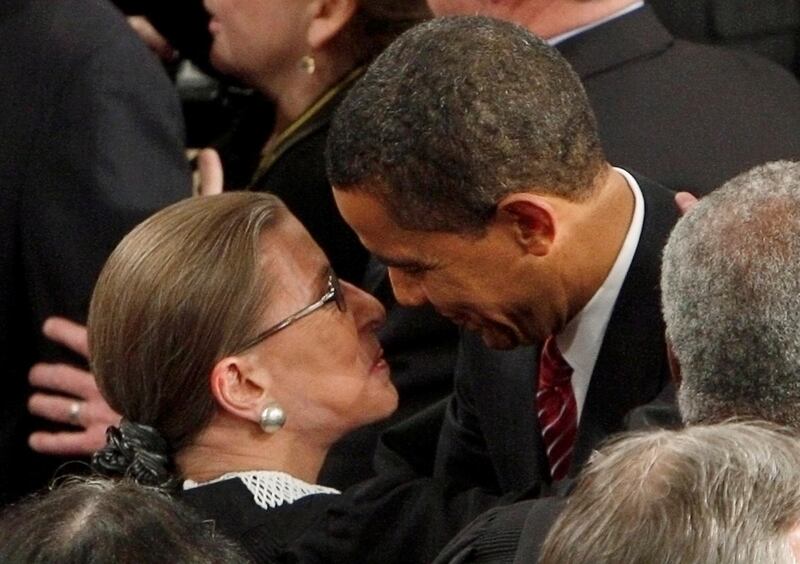 Ruth Bader Ginsburg gets a hug from President Barack Obama as he arrives for his address to a joint session of Congress on February 24, 2009. Reuters
