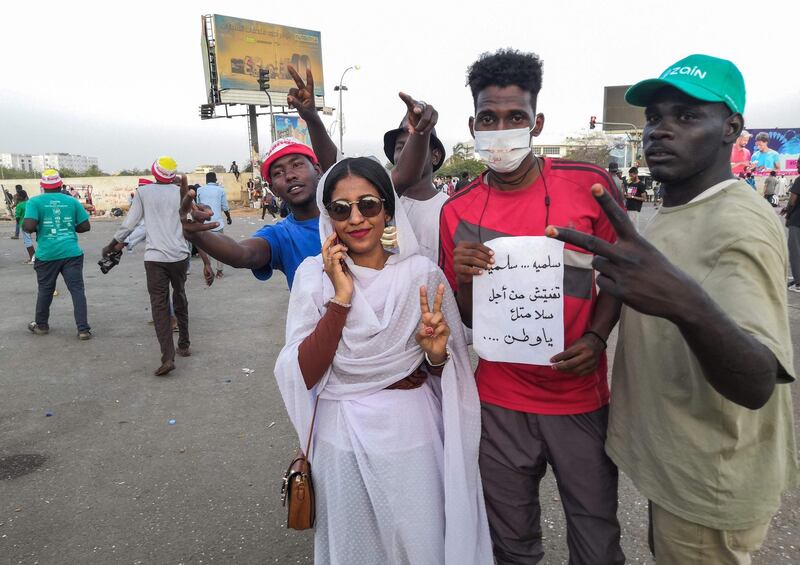 Alaa Saleh poses with fellow protesters. AFP