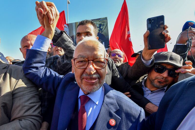 Rached Ghannouchi arriving at a police station in Tunis after his arrest. AFP