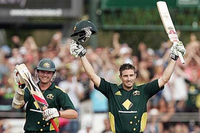 Australia's Shaun Marsh celebrates his 100th run in Hobart.