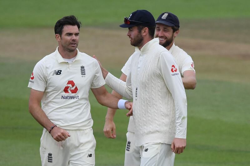 England's James Anderson is congratulated after taking his fifth wicket. AFP
