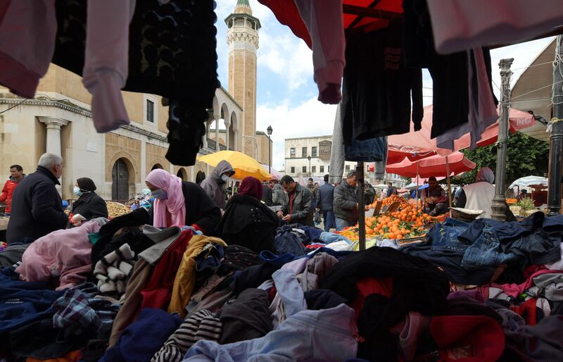 Tunisians shop at Halfaouine market near central Tunis. The North African country is mired in a deep recession. AFP