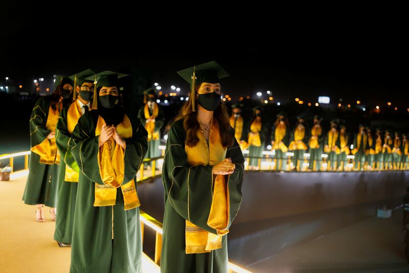 Students line up to receive their certificates during the Visual Graduation Ceremony 2021 of Bahrain Bayan School in Sakhir. About half of young Bahrainis said they felt the pandemic affected their educational. Photo: Hamad I Mohammed / Reuters