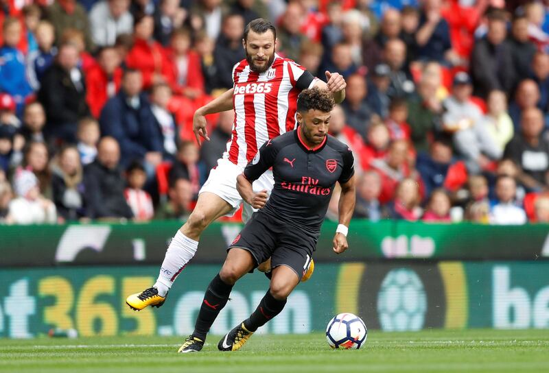 Alex Oxlade-Chamberlain, right, another who is down to the final year of his contract, was the subject of a £35 million bid from Chelsea this week but it is being reported in British media the England midfielder will turn down the offer in favour of a move to Liverpool. Carl Recine / Reuters