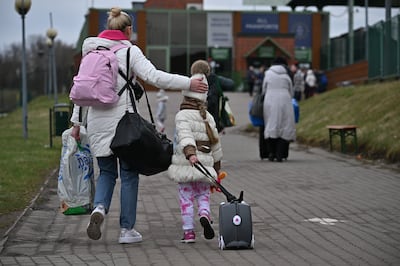 People, mostly women and children, cross from war-torn Ukraine into Poland at the Medyka border crossing in April. Getty images