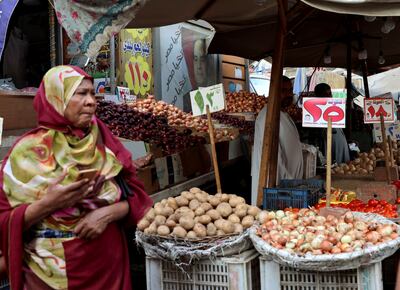 A market vendor waits for customers in Cairo. The President says economic meltdown has been averted thanks to his policies but critics disagree. Reuters