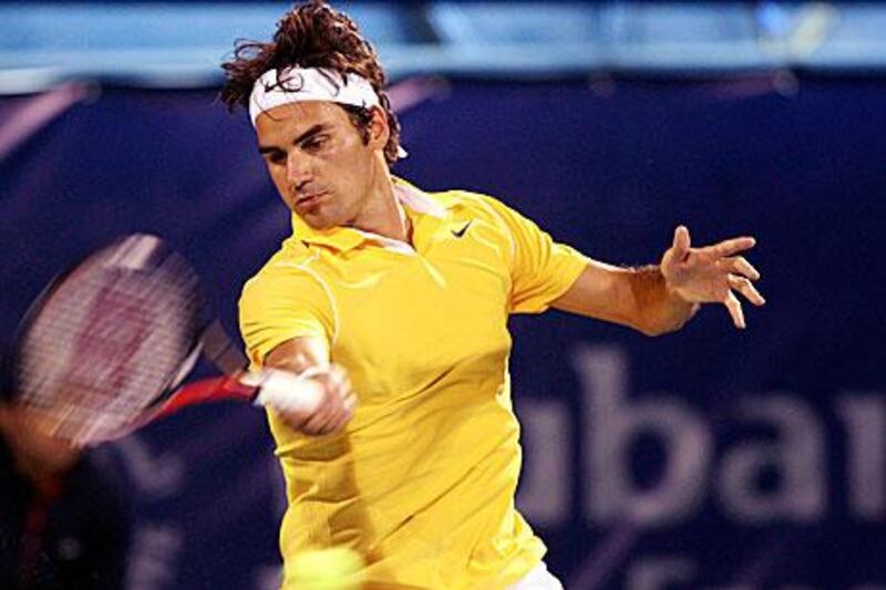 Roger Federer returns the ball to Sergiy Stakhovsky during their Dubai Duty Free Tennis Championships yesterday.