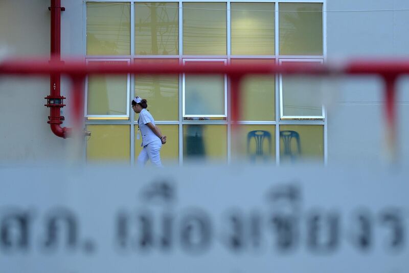 A nurse walks in front of the hospital where four of the boys rescued on Sunday are being treated. AFP
