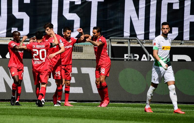 Leverkusen's Kai Havertz, 3rd left, celebrates with teammates scoring. AP