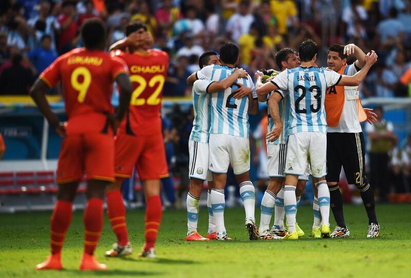 Argentina's players celebrate after winning their quarter-final football match against Belgium on Saturday at the 2014 World Cup. Pedro Ugarte / AFP