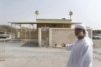 RAS AL KHAIMAH, UNITED ARAB EMIRATES - AUGUST 12, 2018. 

On Saturday, 6 year old Salem Ali, was playing in the area outside his Al Shamal home when he walked into an unlocked electrical room and accidentally electrocuted himself.

Saeed Al Marri, a relative of the deceased boy, stands infront of the electrical room where Salem was found later by his mother. 

(Photo by Reem Mohammed/The National)

Reporter: RUBA HAZA
Section:  NA