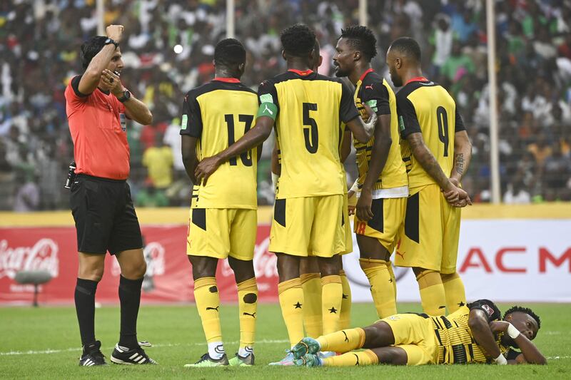 Ghana players line-up for a free-kick. AFP